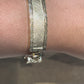 CHINO BRACELET WITH ST. JUDE ON TWO PLATES AND GREEK KEY BORDER ON ALL THREE PLATES, CENTER PLATE PLAIN 52.80 GM